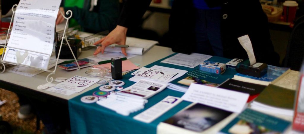 Photo of a stall with pamphlets and paper on it